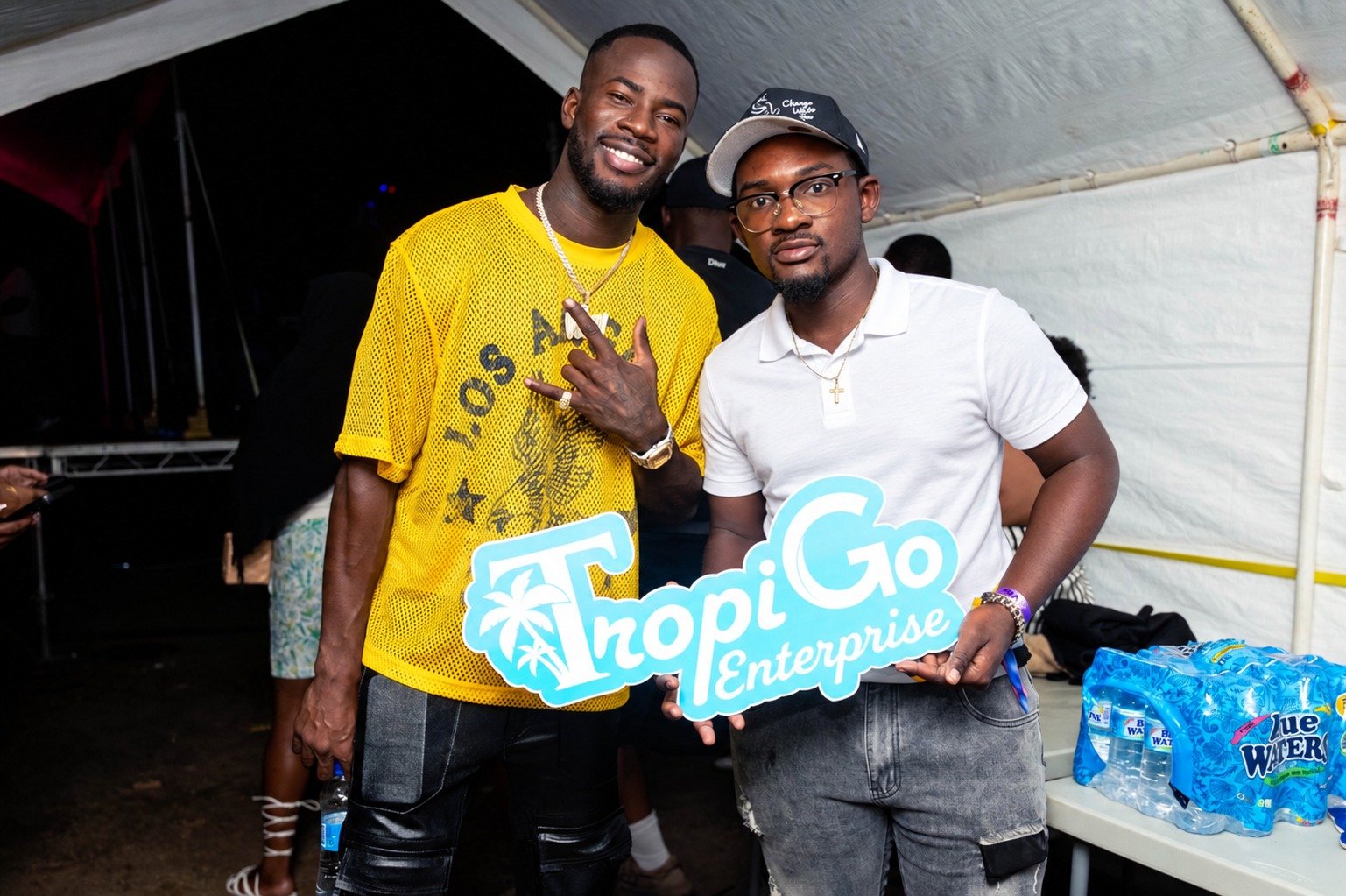 TropiGo representative in a white polo sharing a moment at an event.