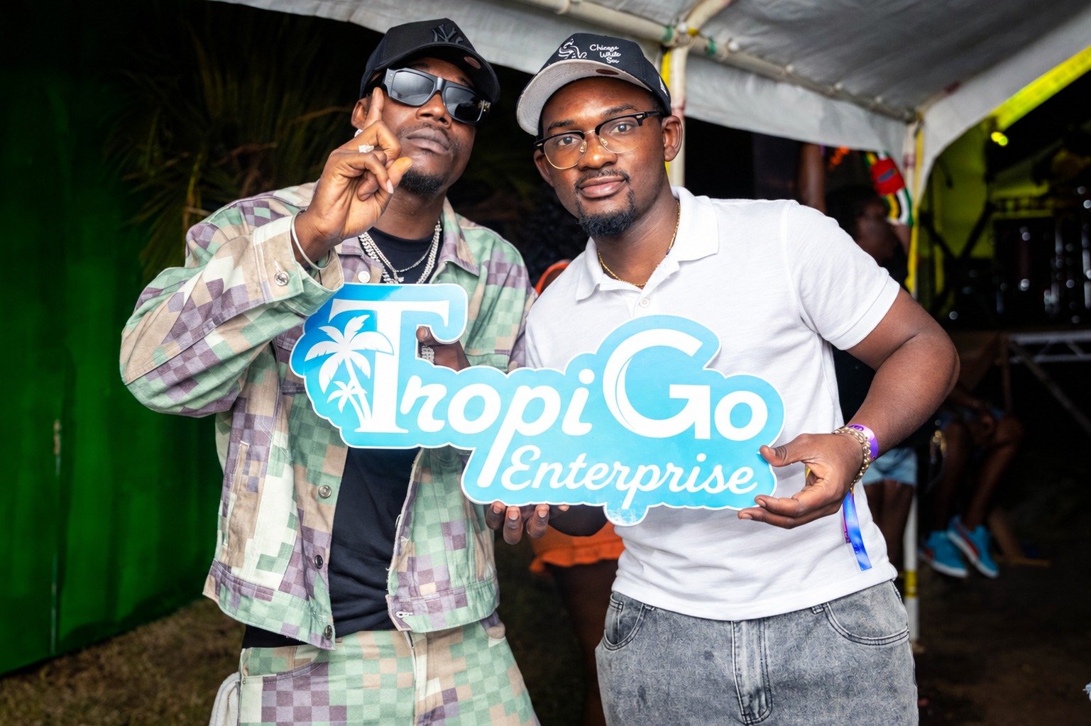 TropiGo representative in a white polo sharing a moment at an event.
